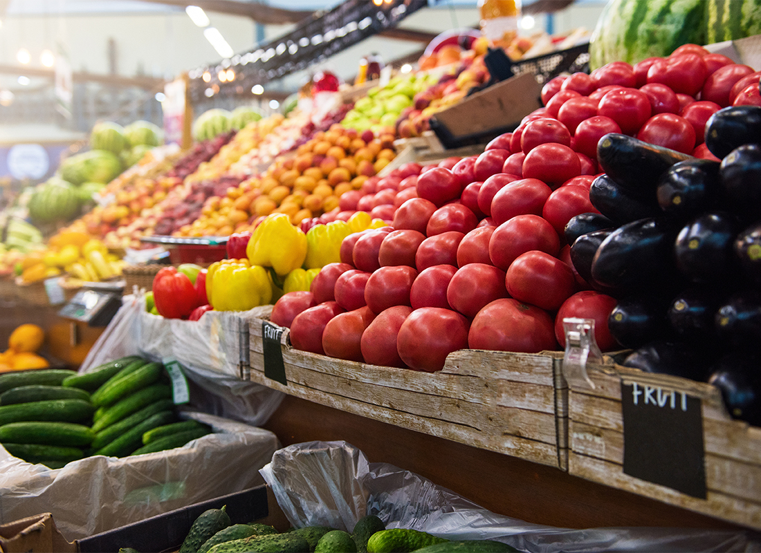 An array of fruits and vegetables at a grocery store.