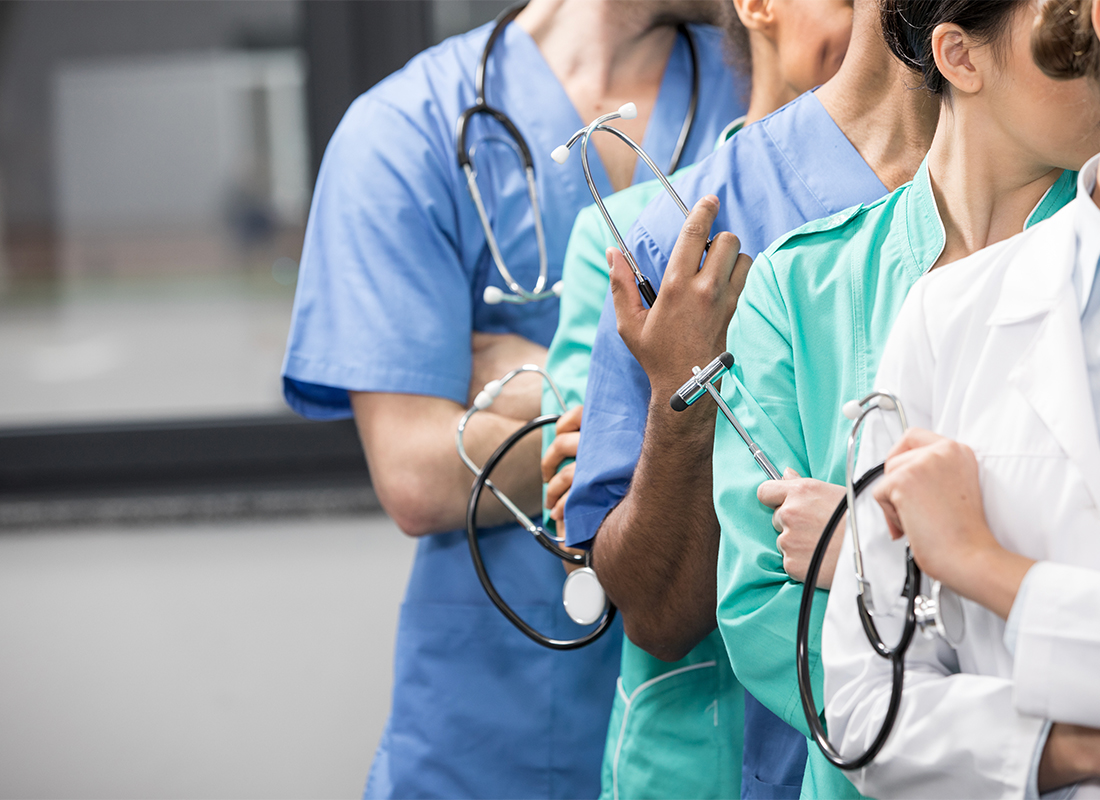 Healthcare workers standing in a line.