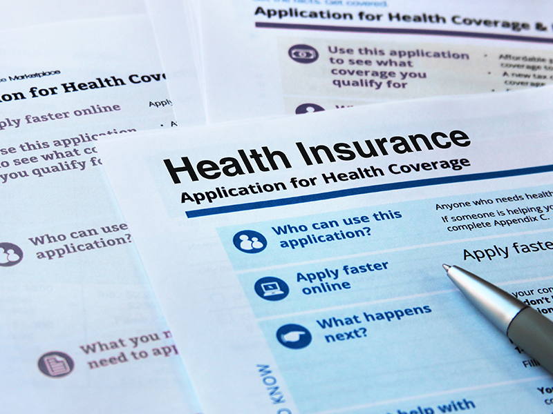 A pile of health insurance documents.